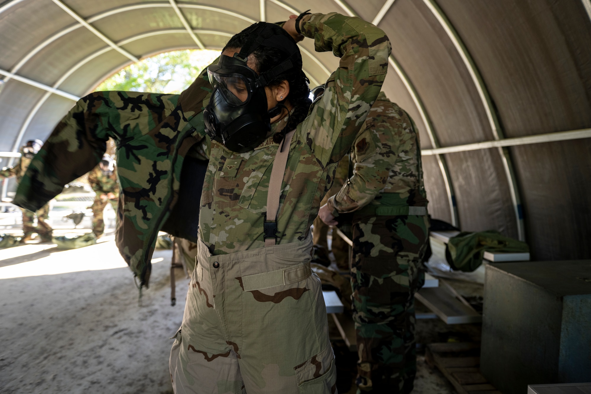 A U.S. Air Force Airman assigned to the 23rd Wing dons Chemical, Biological, Radiological and Nuclear gear