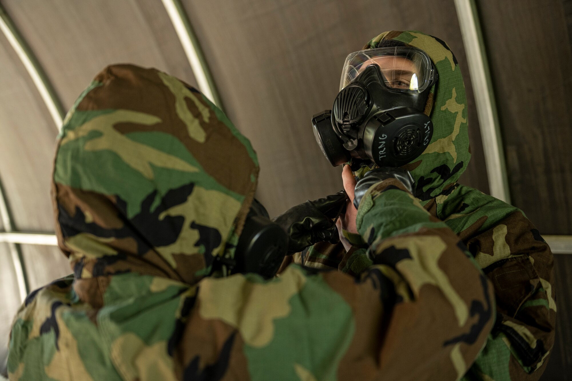 U.S. Airmen assigned to the 23rd Wing perform buddy checks