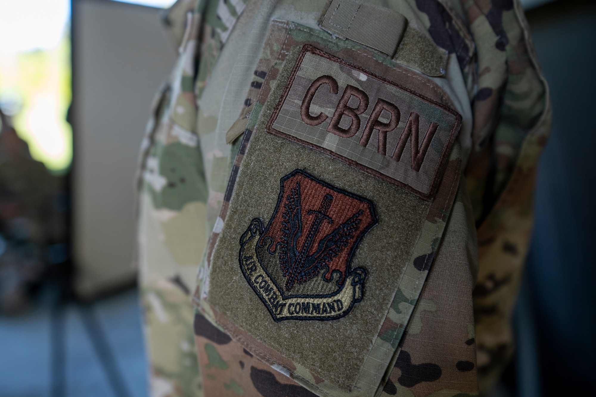 U.S. Air Force Staff Sgt. Barry Donewar, 23rd Civil Engineer Squadron Chemical, Biological, Radiological and Nuclear instructor, wears a CBRN patch