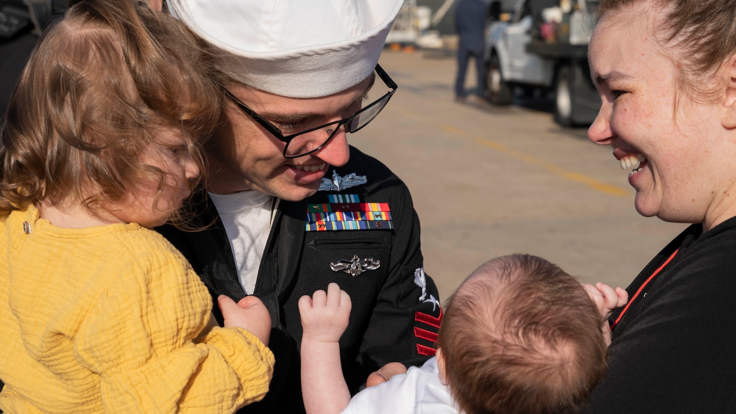 A Sailor assigned to the guided-missile destroyer USS Nitze (DDG 94) is reunited with his family after Nitze returned to Naval Station Norfolk following a scheduled deployment April 5, 2023.
