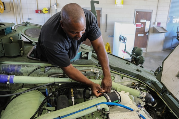 Eddie L Sims Jr., a contractor supporting Materiel Management Operations Group, 2D Force Storage Battalion, Marine Force Storage Command, replaces a coupling on a Light Amphibious Vehicle while at Marine Corps Logistics Base Albany, Ga., March 6, 2023. (U.S. Marine Corps photo by Jennifer N. Napier)