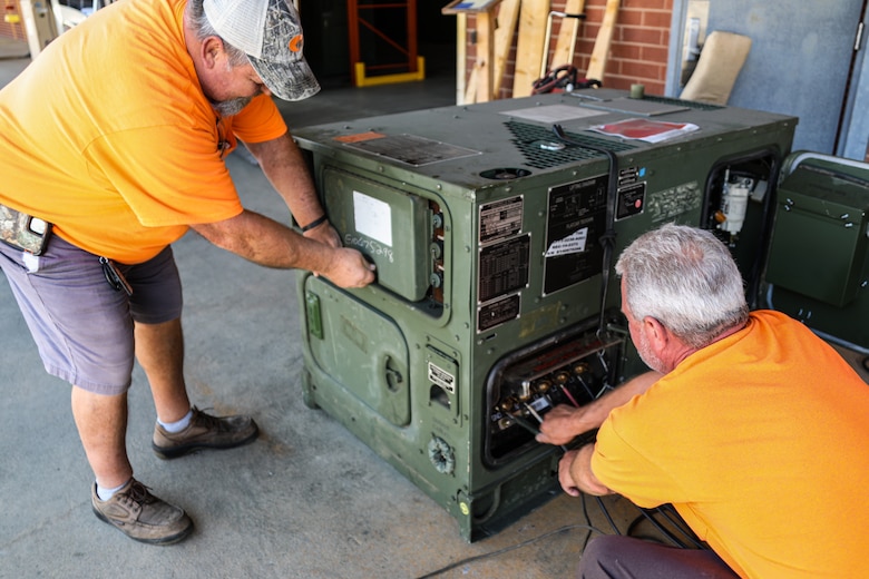 Donny Senn, left, and Rodney L. Cannon, contractors supporting Materiel Management Operations Group, 2D Force Storage Battalion, Marine Force Storage Command, complete a limited technical inspection on a generator while at Marine Corps Logistics Base Albany, Ga., March 6, 2023.