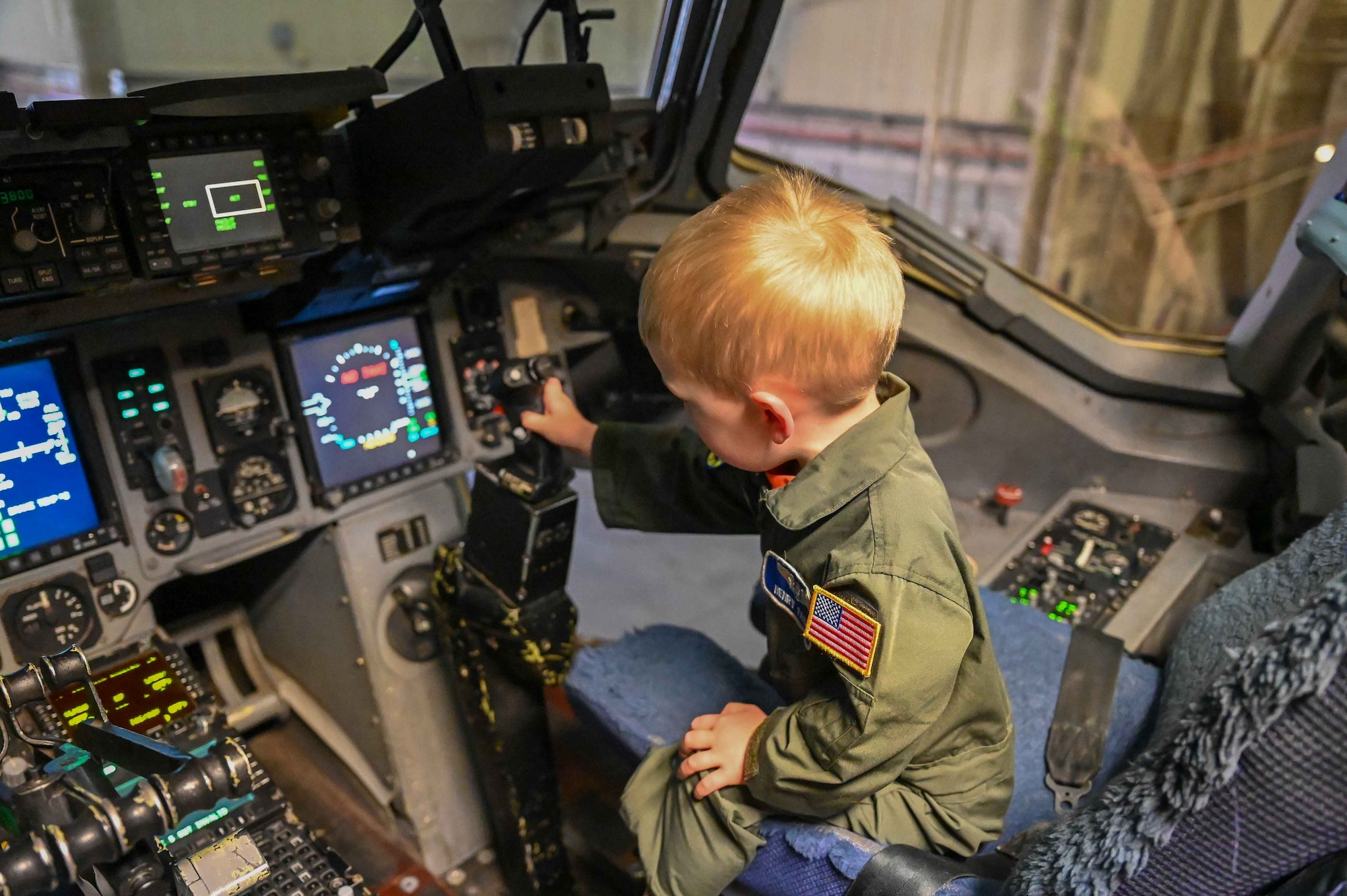 Henry Fabis, son of Tech. Sgt. Jonathan Fabis, 58th Airlift Squadron loadmaster instructor, plays with the controls on a C-17 Globemaster III during the “Kid’s Deployment Line” at Altus Air Force Base (AFB), Oklahoma, April 1, 2023. The event had nearly 100 volunteers from several different units at Altus AFB. (U.S. Air Force photo by Airman 1st Class Kari Degraffenreed)