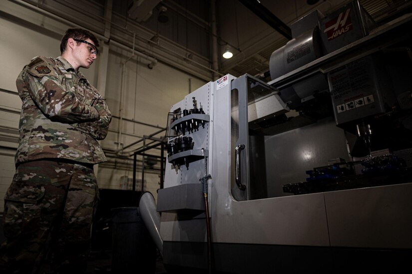 U.S Air Force Staff Sgt. Austin Root operates a VF-4 CNC machine