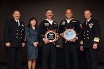 WASHINGTON (April 5, 2023) -- NAVSEA announced it’s active duty and reserve 2022 Sailor of the Year winners during an award ceremony at the Washington Navy Yard. Navy Diver 1st Class Mathew Villafuerte, NUWC Keyport won in the active-duty category, and Master-At-Arms 1st Class Jose Rivera, Navy Security Force Atlantic Undersea Test and Evaluation Center, won in the reserve category. They are seen here with CMC Justin Gray, Executive Director, Ms. Giao Phan, and Vice Admiral Galinis. (U.S. Navy photo by Laura Lakeway)