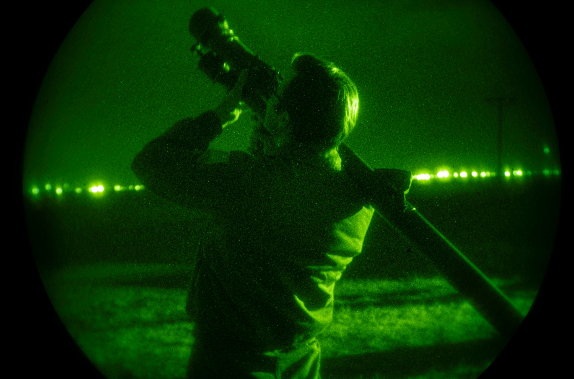 U.S. Air Force Senior Airman Josephus Straka, 909th Air Refueling Squadron in-flight refueling specialist, simulates nighttime ground threat using a training simulated man-portable air defense [missile] system during the threats and tactics phase of the 509th Weapons School (WPS) course at Roswell Air Center in Roswell, New Mexico, March 15, 2023. 509th WPS Students performed hands-on training and gained perspective as the aggressor using simulated man-portable air defense [missile] systems (MANPADS).  (U.S. Air Force photo by 2nd Lt. Ariana Wilkinson)