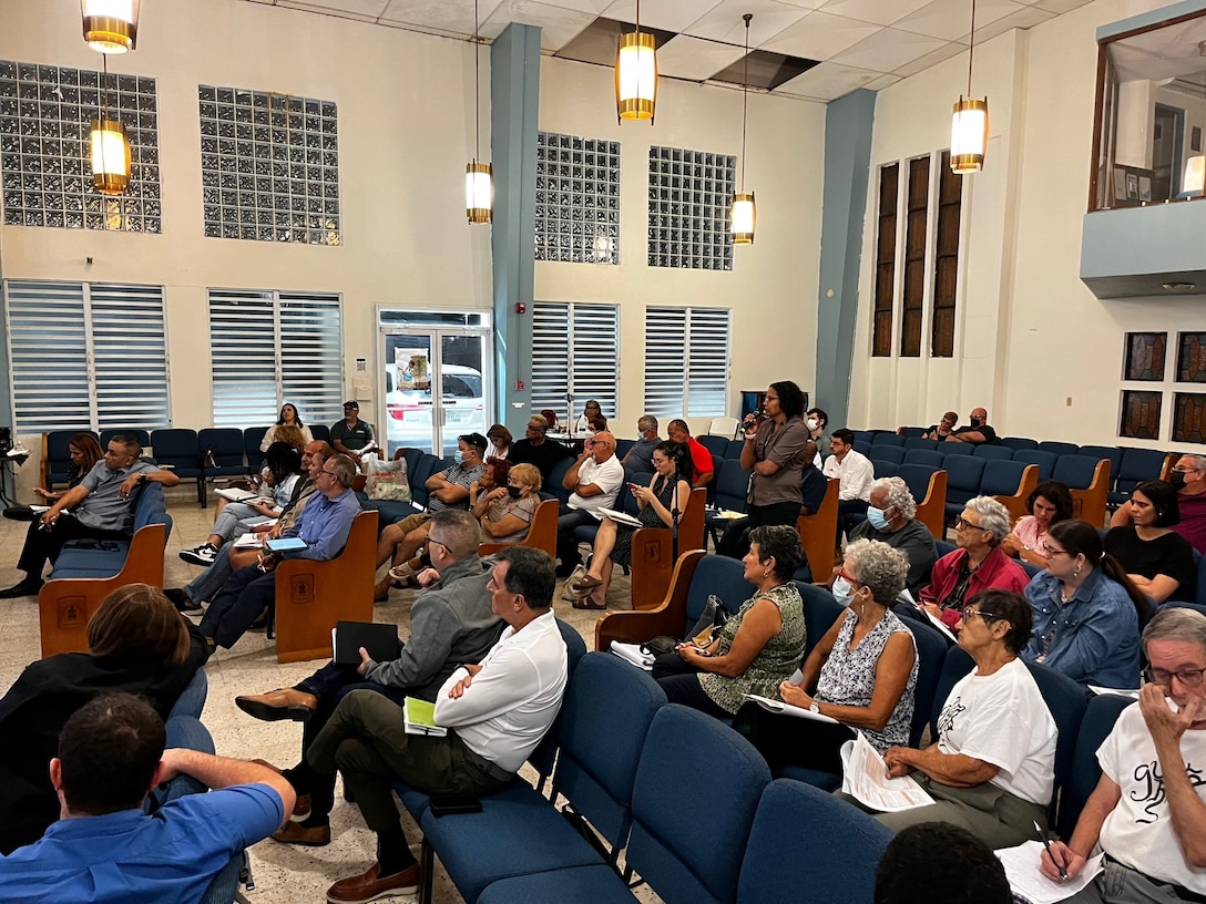 People gather at a church during a USACE public meeting.