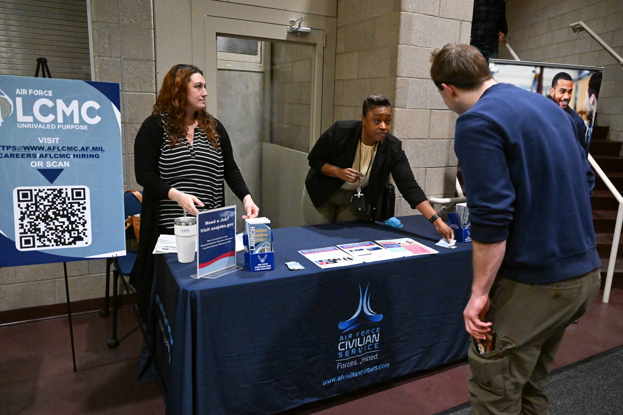 image of people talking across a table