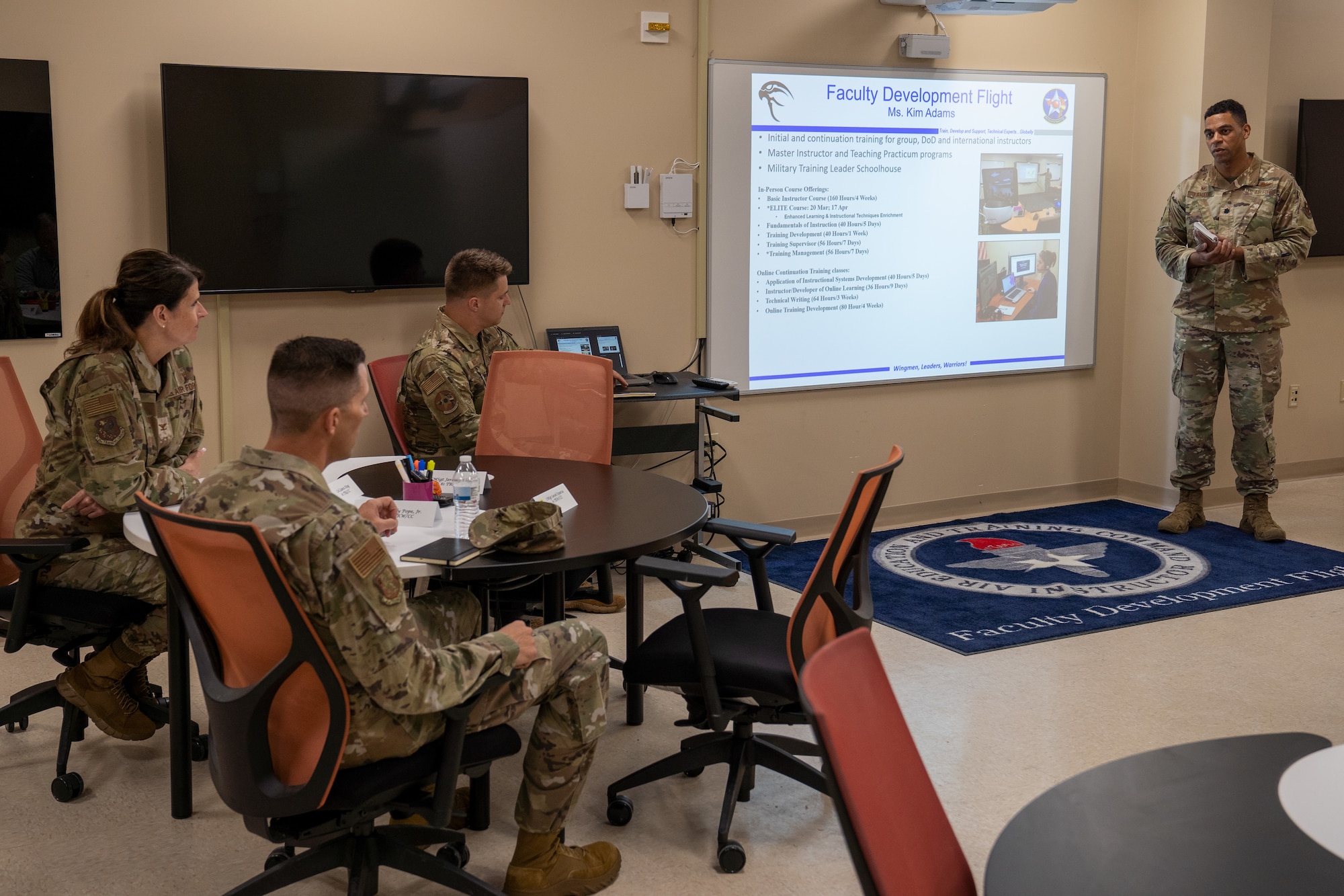 U.S. Air Force Lt. Col. Alex Lamkin, 81st Training Support Squadron commander, briefs 81st Training Wing leadership during the 81st Training Group Immersion Tour at Matero Hall on Keesler Air Force Base, Mississippi, April 4, 2023.