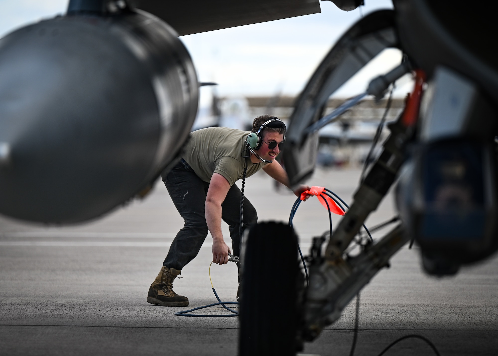 U.S. Air Force Airman Thomas Blazina, 55th Fighter Generation Squadron assistant dedicated crew chief, performs pre-flight checks during exercise Red Flag-Nellis (RF-N) 23-2 at Nellis Air Force Base, Nevada, March 15, 2023. The 20th Maintenance Group is a vital component to the Wild Weasel mission, and the Airmen involved in supporting RF-N 23-2 are critical to delivering combat airpower and ensuring the 20th Fighter Wing aircrew receive world-class training. (U.S. Air Force photo by Staff Sgt. Madeline Herzog)