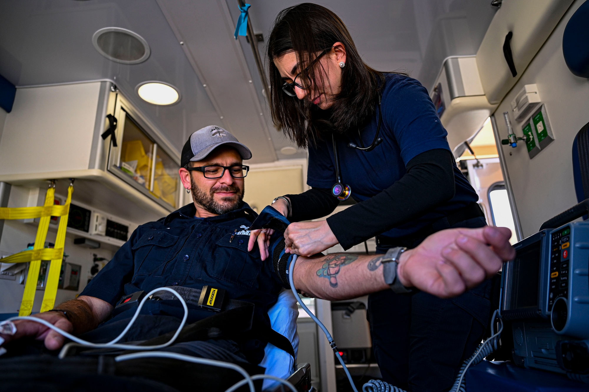 Azriel O’Neal, right, 49th Medical Group paramedic, checks the vitals of Michael Curtis, 49th MDG emergency medical technician, during an exercise at Holloman Air Force Base, New Mexico, April 3, 2023. Both the EMTs and paramedics at Holloman are responsible for providing first-aid care and transportation for patients to hospitals or other nearby healthcare facilities. (U.S. Air Force photo by Airman 1st Class Isaiah Pedrazzini)