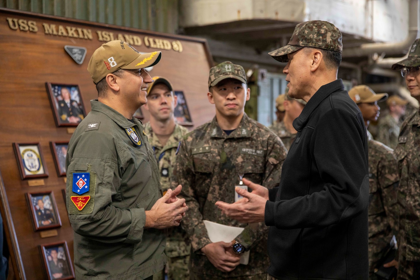 Capt. Tony Chavez, commanding officer of amphibious assault ship USS Makin Island (LHD 8), speaks to Vice Adm. Myung Soo Kim, commander, Republic of Korea (ROK) Fleet for a key leader engagement aboard Makin Island during Operation Ssang Yong 2023 (SY23), March 24 in South Korea. SY23 is a U.S./ROK joint landing drill to strengthen the alliance’s combat readiness, ensure tailored capabilities for defense, and improve interoperability to protect peace by strength. The Makin Island Amphibious Ready Group, comprised of Makin Island and amphibious transport docks USS Anchorage (LPD 23) and USS John P. Murtha (LPD 26), is operating in the U.S. 7th Fleet area of operations with the embarked 13th Marine Expeditionary Unit to enhance interoperability with Allies and partners and serve as a ready-response force to defend peace and maintain stability in the Indo-Pacific region.
