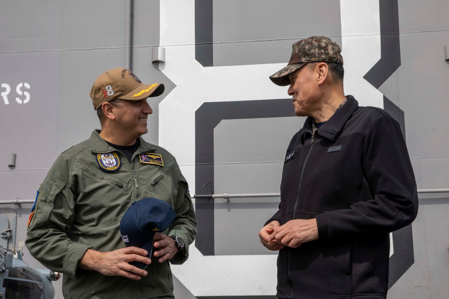 Capt. Tony Chavez, commanding officer of amphibious assault ship USS Makin Island (LHD 8), left, speaks to Vice Adm. Myung Soo Kim, commander, Republic of Korea (ROK) Fleet, during a key leader engagement aboard Makin Island for Operation Ssang Yong 2023 (SY23), March 24 in South Korea. SY23 is a U.S./ROK joint landing drill to strengthen the alliance’s combat readiness, ensure tailored capabilities for defense, and improve interoperability to protect peace by strength. The Makin Island Amphibious Ready Group, comprised of Makin Island and amphibious transport docks USS Anchorage (LPD 23) and USS John P. Murtha (LPD 26), is operating in the U.S. 7th Fleet area of operations with the embarked 13th Marine Expeditionary Unit to enhance interoperability with Allies and partners and serve as a ready-response force to defend peace and maintain stability in the Indo-Pacific region.
