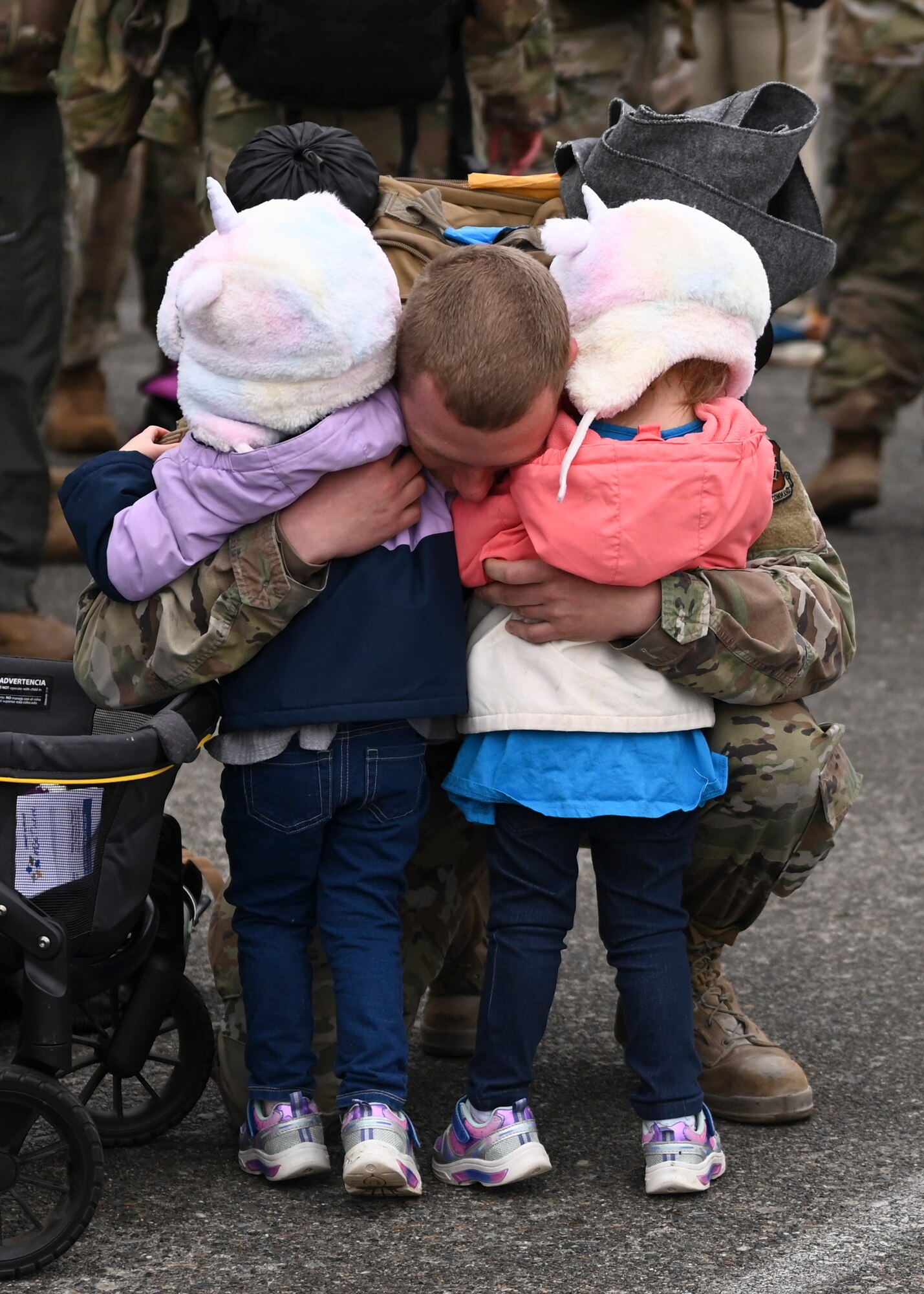 A U.S. Airman with the 62d Airlift Wing is welcomed home from a deployment by loved ones at Joint Base Lewis-McChord, Washington, April 4, 2023. This deployment was the 62d Airlift Wing’s first under the new Air Force Force Generation Model in support of U.S. Central Command, U.S. European Command and U.S. Africa Command operations. The new AFFORGEN model aims to reconstitute Air Mobility Command’s manpower, aircraft and equipment into force elements that train, deploy and recover as cohesive units throughout each phase of the cycle. (U.S. Air Force photo by Senior Airman Callie Norton)