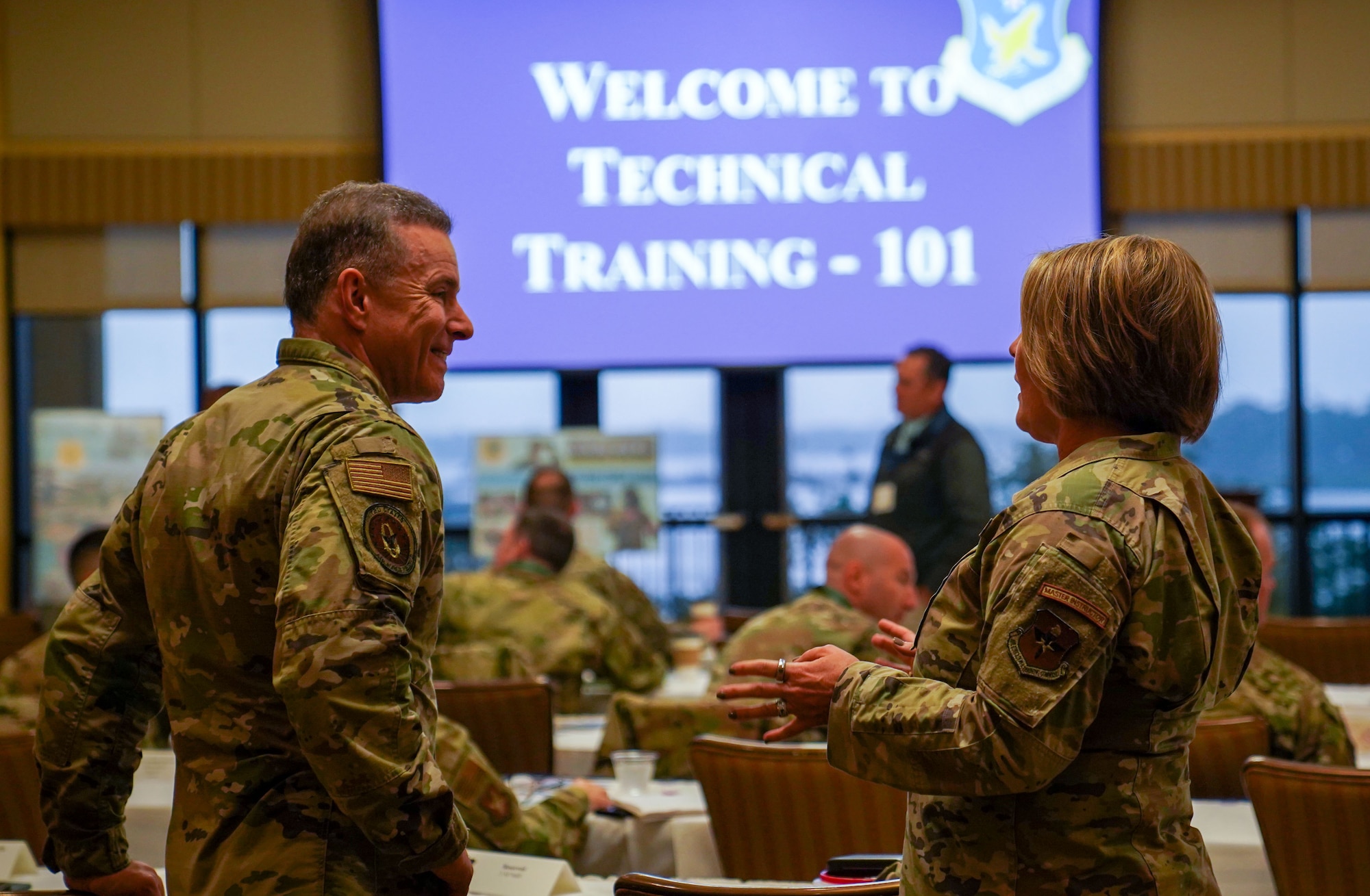 U.S. Air Force Col. Roderick Grunwald, Second Air Force mobilization assistant to the commander, and Chief Master Sgt. Katie McCool, Second Air Force command chief, speak before the start of Technical Training 101 in the Bay Breeze Event Center on Keesler Air Force Base, Mississippi, March 28, 2023.