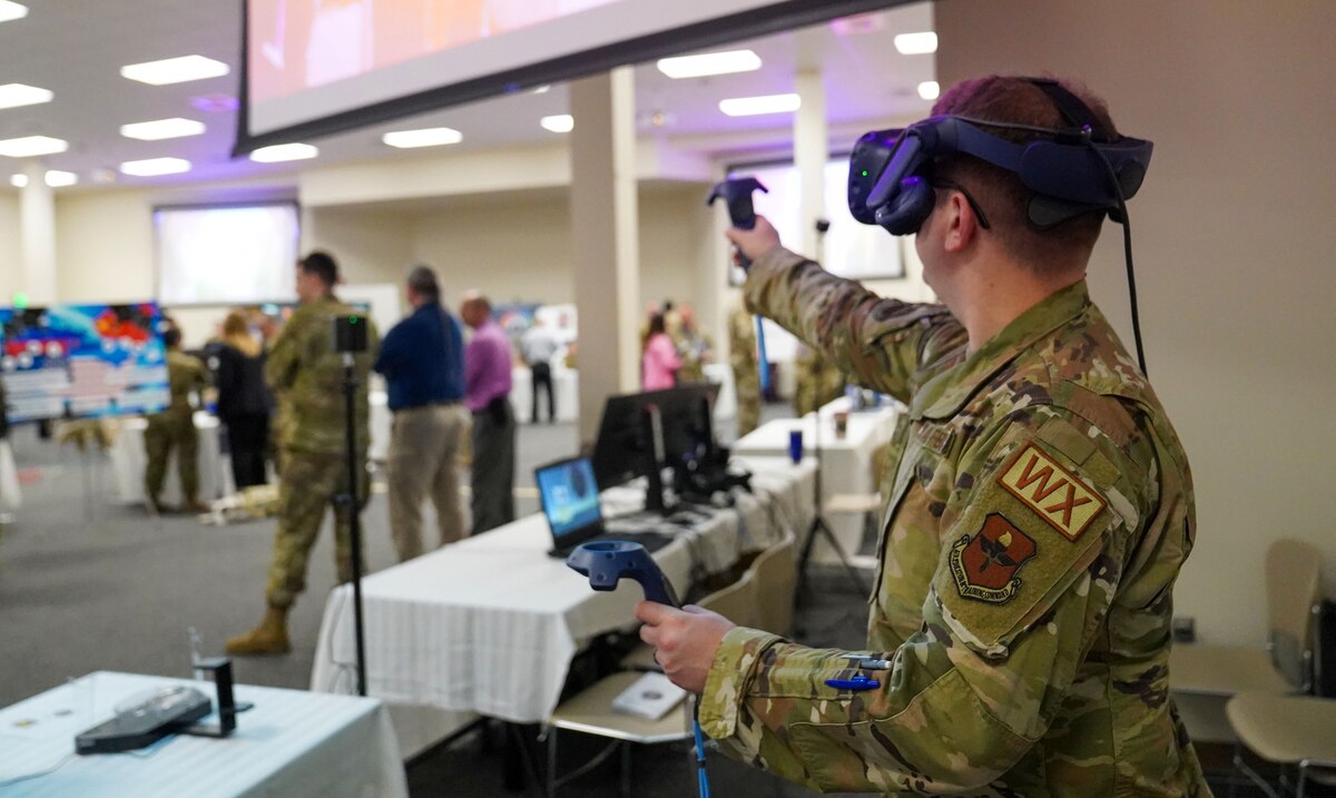 U.S. Air Force Staff Sgt. Matthew Pecori, 335th Training Squadron instructor, uses a virtual reality for weather training at the Technical Training 101 Tech Expo at Keesler Air Force Base, Mississippi, March 30, 2023.