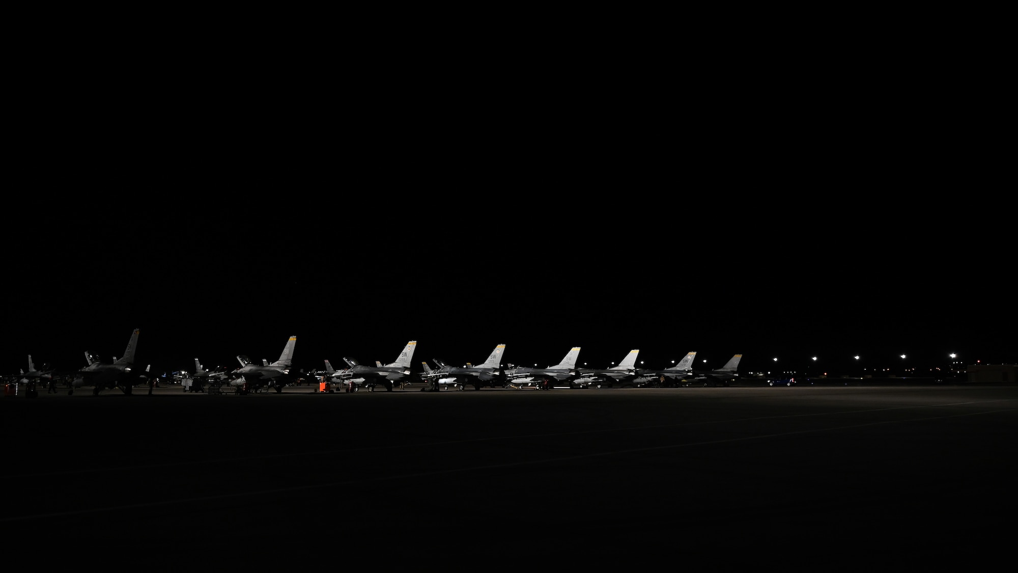 U.S. Air Force F-16 Fighting Falcons stand static on the flightline prior to the night scenarios of exercise Red Flag-Nellis (RF-N) 23-2 at Nellis Air Force Base, Nevada, March 16, 2023. Participants in RF-N 23-2 conduct a variety of scenarios, including defensive counterair, offensive-counterair suppression of enemy air defenses and offensive counterair-air interdiction. (U.S. Air Force photo by Staff Sgt. Madeline Herzog)