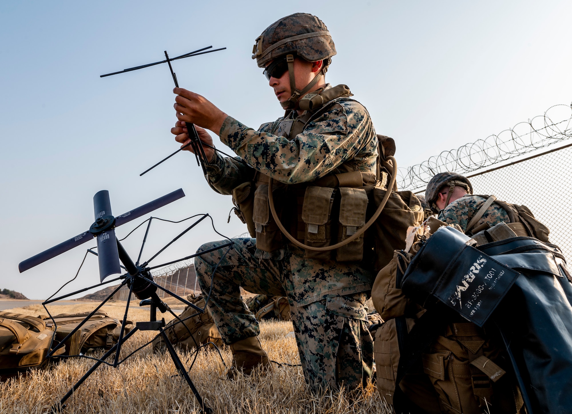 U.S. Marines assigned to 12th Marines, 3d Marine Division, set up ground equipment to assist a High Mobility Artillery Rocket System (HIMARS) training mission in support of Freedom Shield 23 at Kunsan Air Base, Republic of Korea, Mar. 18, 2023.