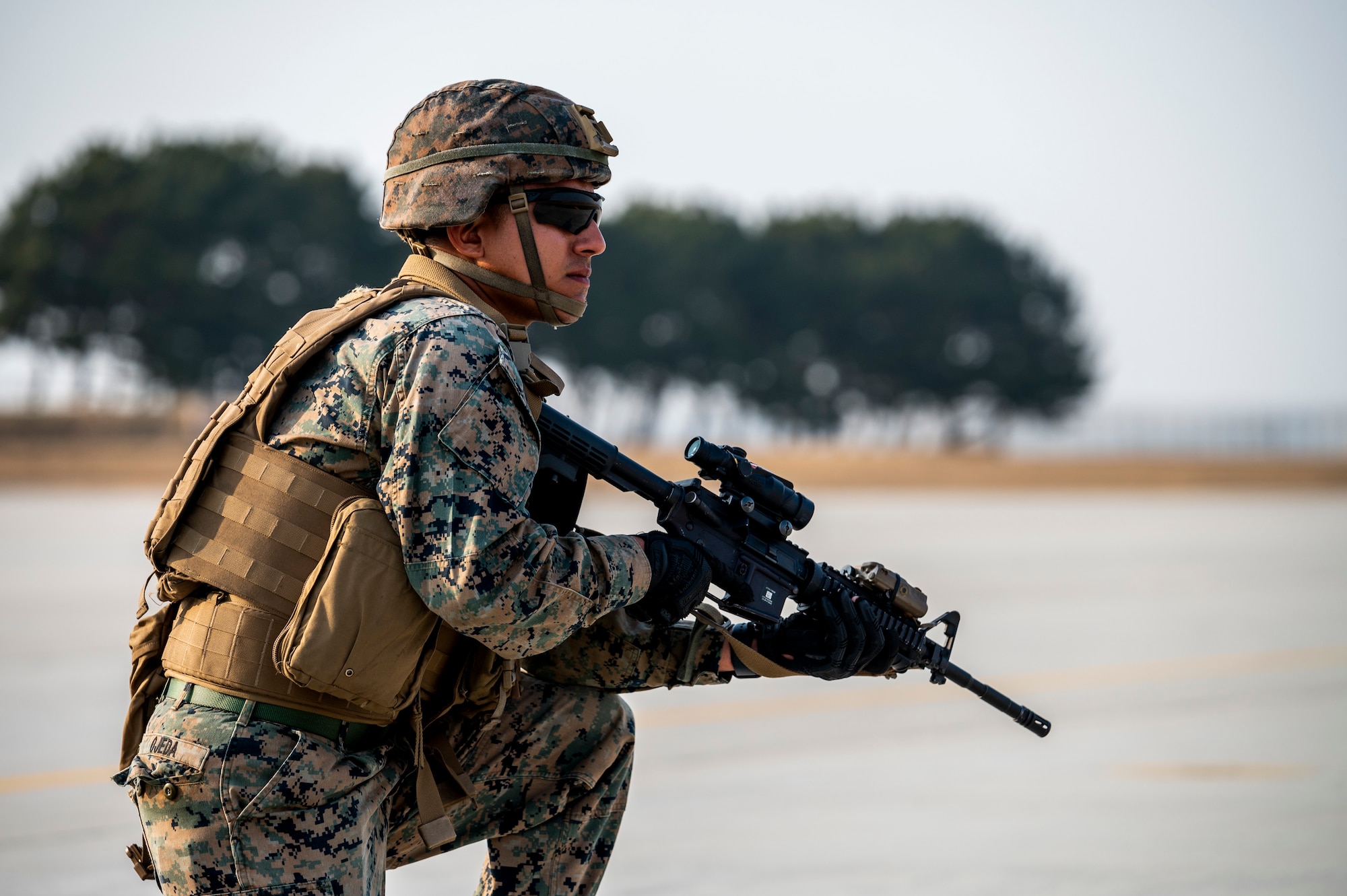 A U.S. Marine from 12th Marines secure an area during a High Mobility Artillery Rocket System (HIMARS) training mission in support of Freedom Shield 23 at Kunsan Air Base, Republic of Korea, Mar. 18, 2023.