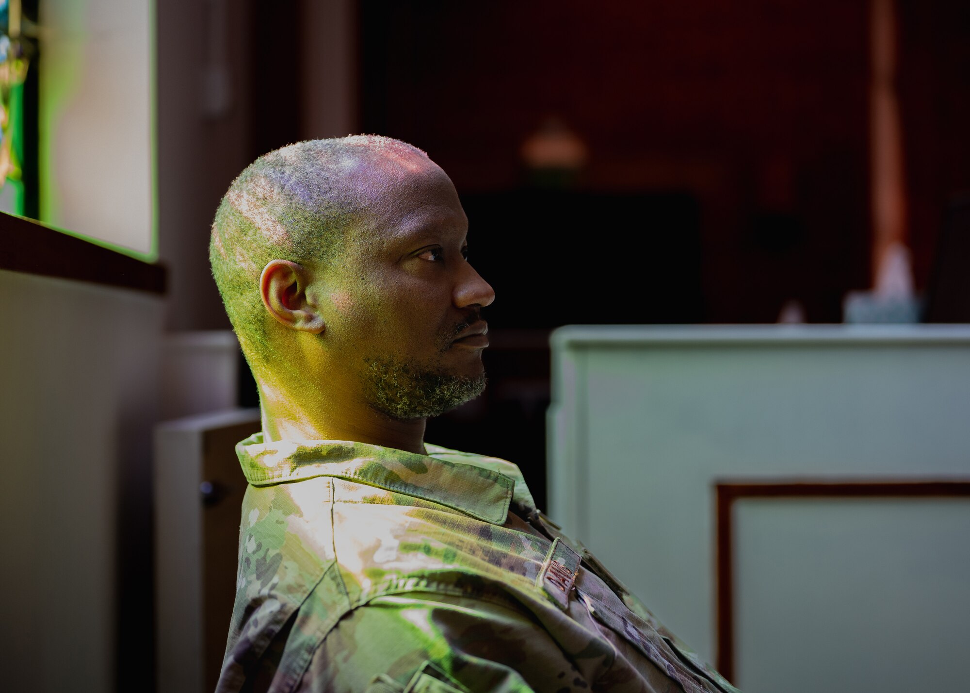 U.S. Air Force Tech. Sgt. Dundre Davis, Liberty Wing Chapel noncommissioned officer in charge of programs and administration, sits inside the Liberty Wing Chapel at Royal Air Force Lakenheath, England, April 3, 2023.