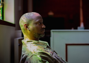 U.S. Air Force Tech. Sgt. Dundre Davis, Liberty Wing Chapel noncommissioned officer in charge of programs and administration, sits inside the Liberty Wing Chapel at Royal Air Force Lakenheath, England, April 3, 2023.