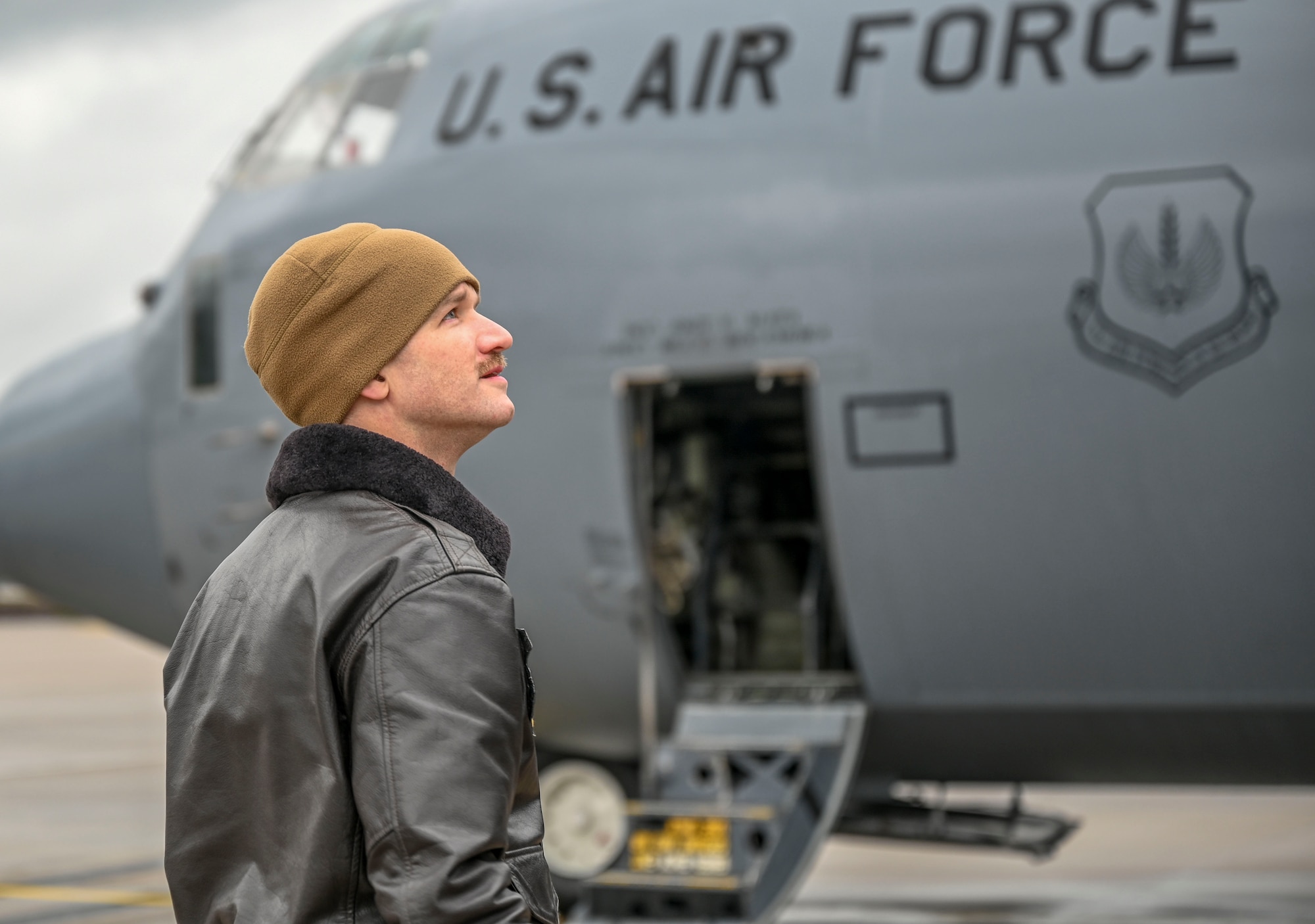 U.S. Air Force Capt. Gregg Burrow, 37th Airlift Squadron C-130J Super Hercules pilot, performs a pre-flight inspection on a C-130J aircraft at Ramstein Air Base, Germany, March 31, 2023.