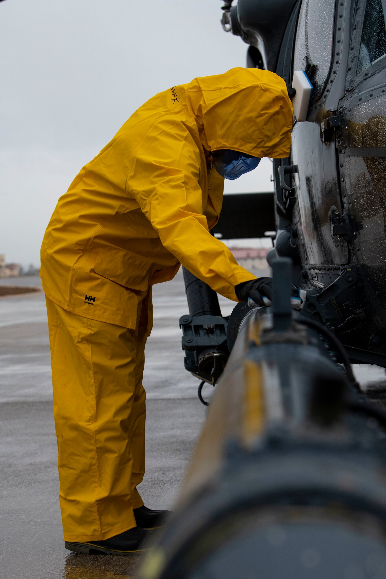 U.S. Air Force Col. Jason Mitchell, 31st Maintenance Group commander, washes an HH-60G Pave Hawk helicopter as part of an immersion tour