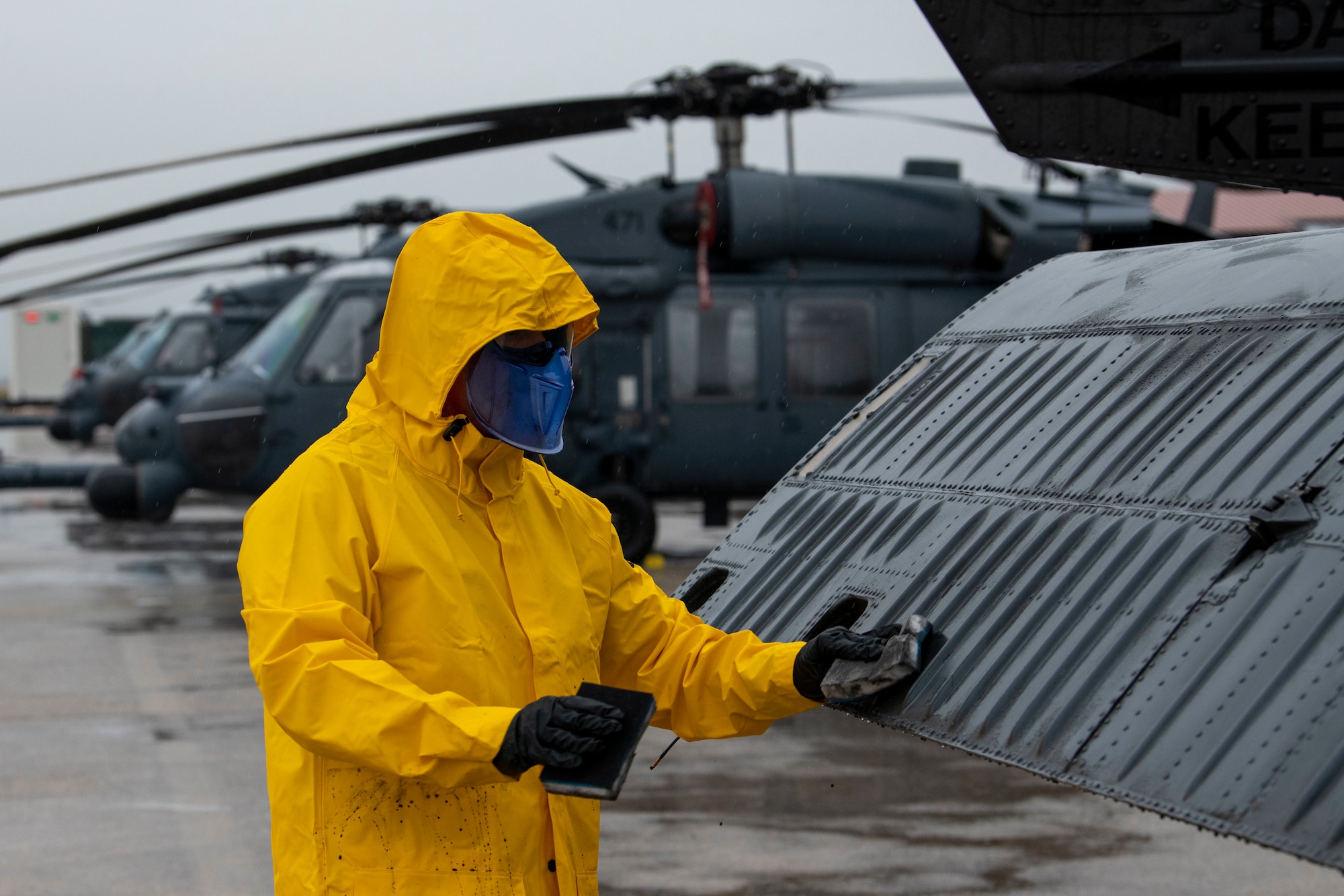 U.S. Air Force Col. Jason Mitchell, 31st Maintenance Group commander, washes an HH-60G Pave Hawk helicopter as part of an immersion tour