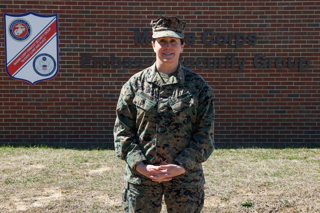 U.S. Marine Corps Col. Kelly Frushour, Marine Corps Embassy Security Group commanding officer, poses in front of the Marine Corps Embassy Security Guard sign at Marine Corps Base Quantico, Virginia, on March 8, 2023. Frushour began her career in the Marine Corps as a public affairs officer and was selected to be a commanding officer for multiple commands throughout her career. (U.S. Marine Corps photo by Lance Cpl. Jennifer Sanchez)