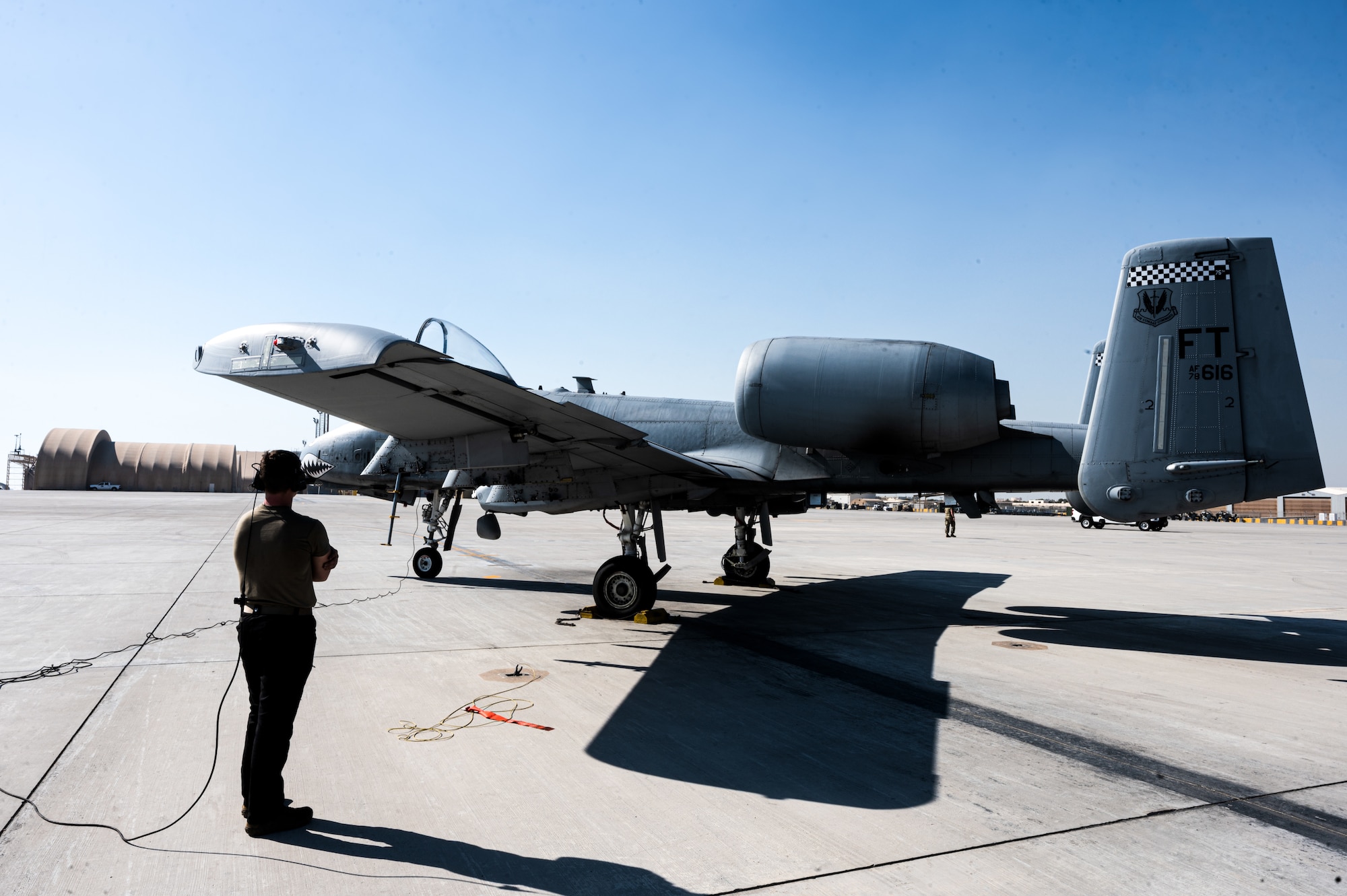 U.S. Air Force Airman First Class Mayson Browning, 75th Expeditionary Fighter Generation Squadron crew chief, prepares a U.S. Air Force A-10 Thunderbolt II before the first sortie at Al Dhafra Air Base, United Arab Emirates, April 6, 2022. Since its creation in 1975, the A-10 has provided air support to ground troops, destroying adversary forces and infrastructure as the first aircraft designed specifically for close air support. (U.S. Air Force photo by Staff Sgt Sabatino DiMascio)