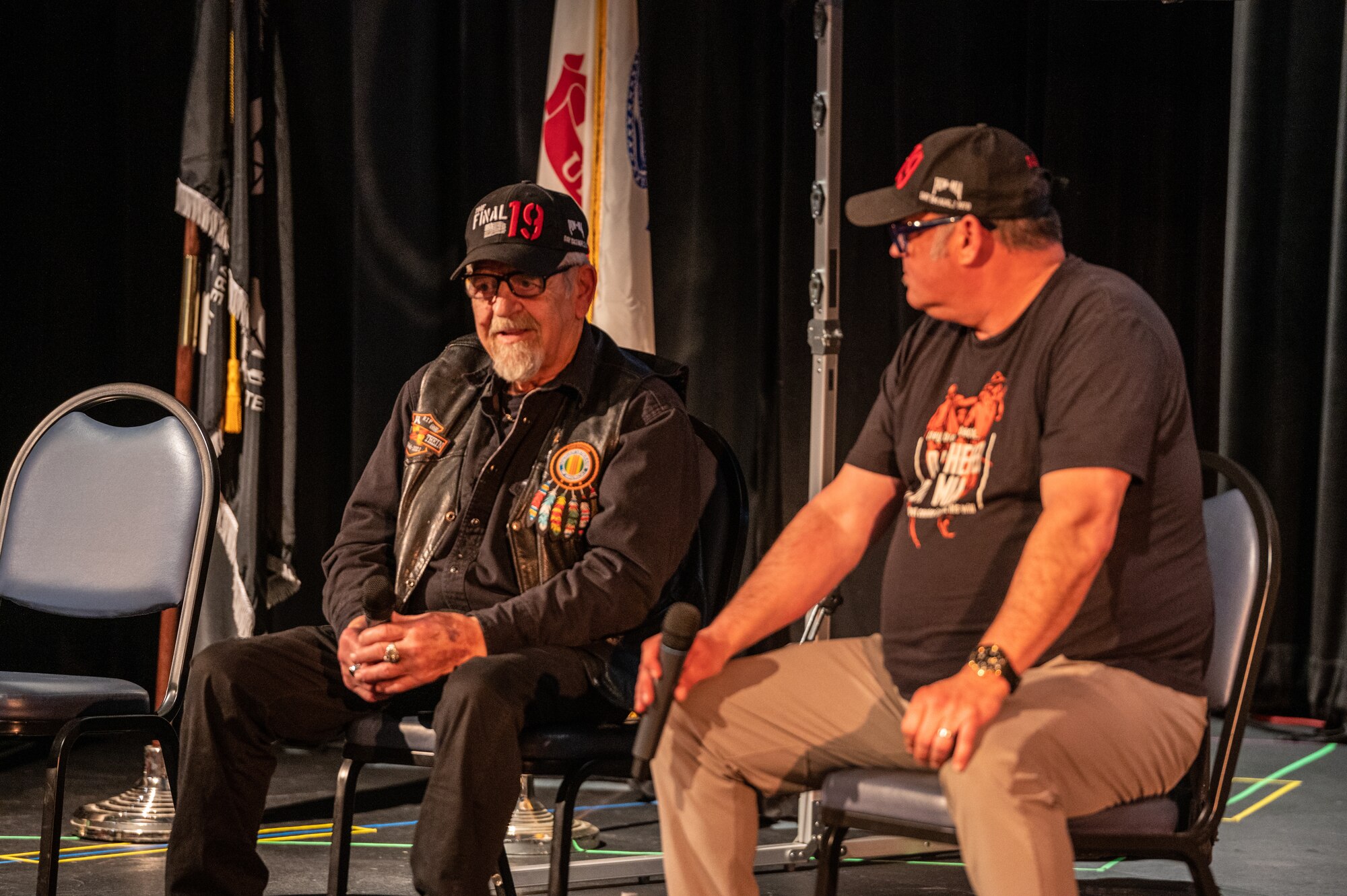 two men sit