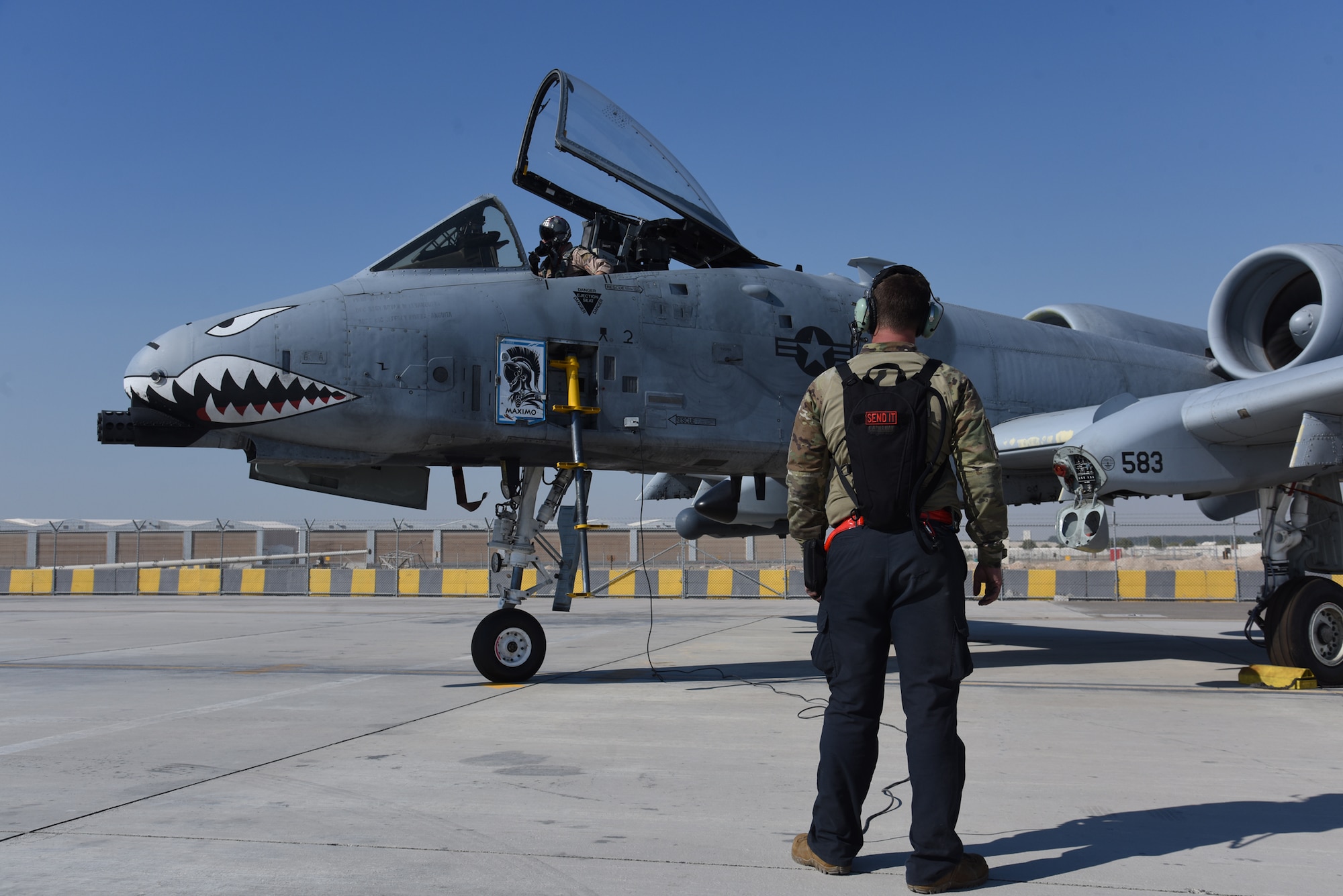 U.S. Air Force Airman First Class Matthew Cover, 75th Expeditionary Fighter Generation Squadron crew chief, prepares a U.S. Air Force A-10 Thunderbolt II for the first sortie at Al Dhafra Air Base, United Arab Emirates, April 6, 2023. The training mission was the first flown by an A-10 Thunderbolt II assigned to the 380th Air Expeditionary Wing and highlights the 380th AEW relationship with their UAE service member counterparts who share the airspace and runway around Al Dhafra AB. (U.S. Air Force photo by Tech. Sgt. Chris Jacobs/released)