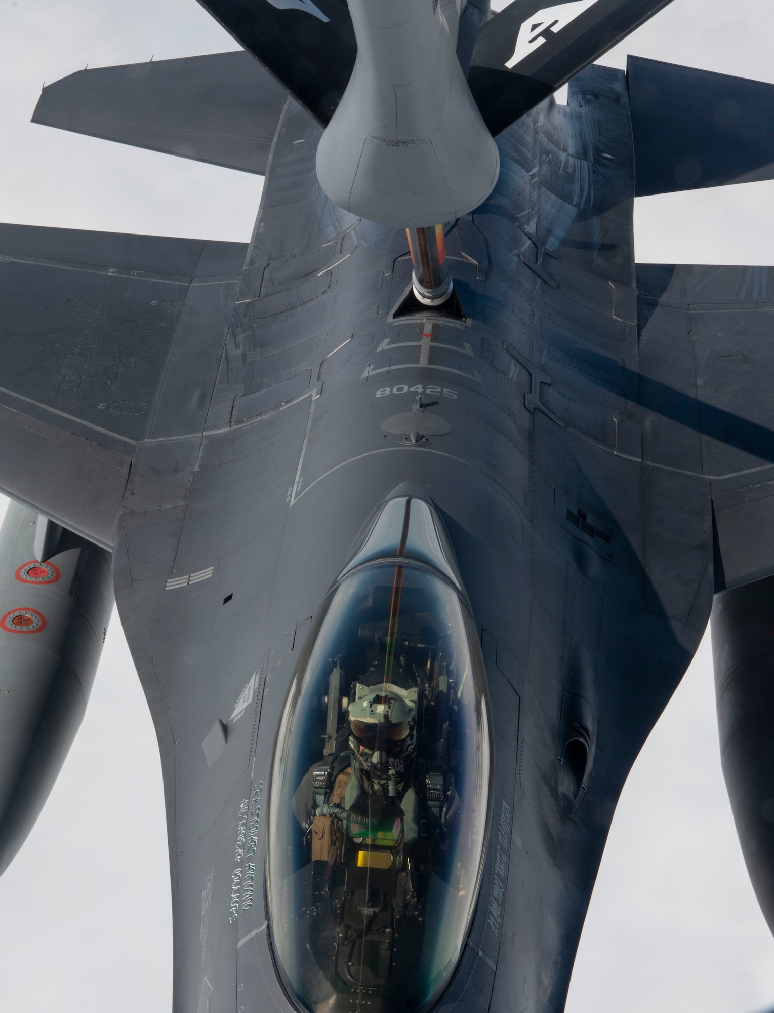 An F-16 Fighting Falcon pilot from the 555th Fighter  Squadron conducts in-flight air refueling during a total force training event