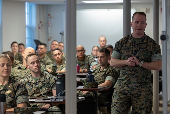 U.S. Marine Corps Maj. Brandon Garton, a student taking the Joint Humanitarian Operations Course, presents for a group exercise during the course aboard Marine Corps Base Camp Lejeune, North Carolina, March 22, 2023. The course trains and prepares the II Marine Expeditionary Force Command Element to become a Joint Task Force–Capable headquarters; able to rapidly organize and establish command and control of joint forces to effectively execute potential humanitarian aid and disaster relief missions in joint and multinational environments.