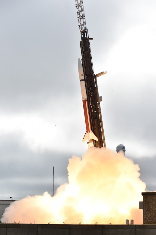 Fire and smoke billow from a missile as it launches.