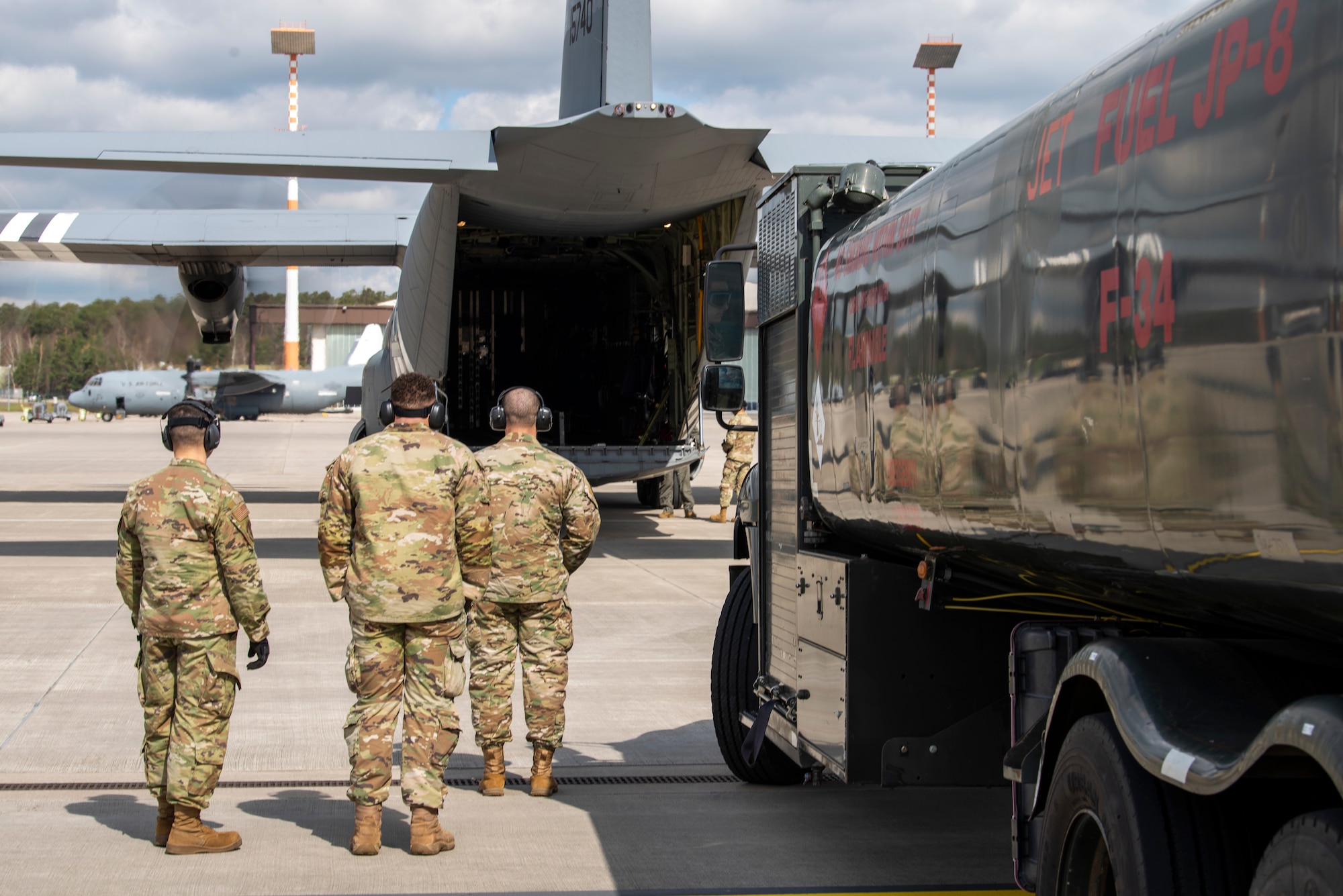 Airmen stand by refuel truck