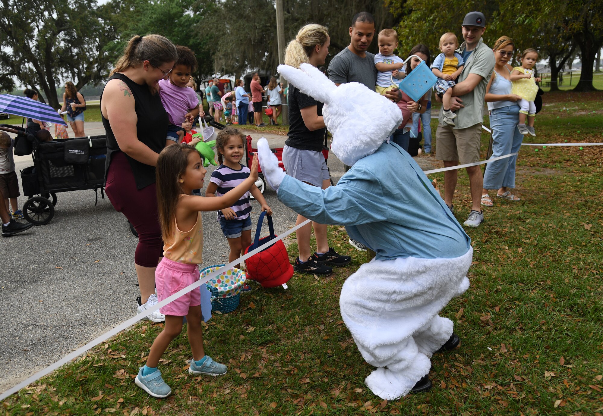 The Easter Bunny visits with Keesler families during Easter in the Park at Keesler Air Force Base, Mississippi, April 1, 2023.