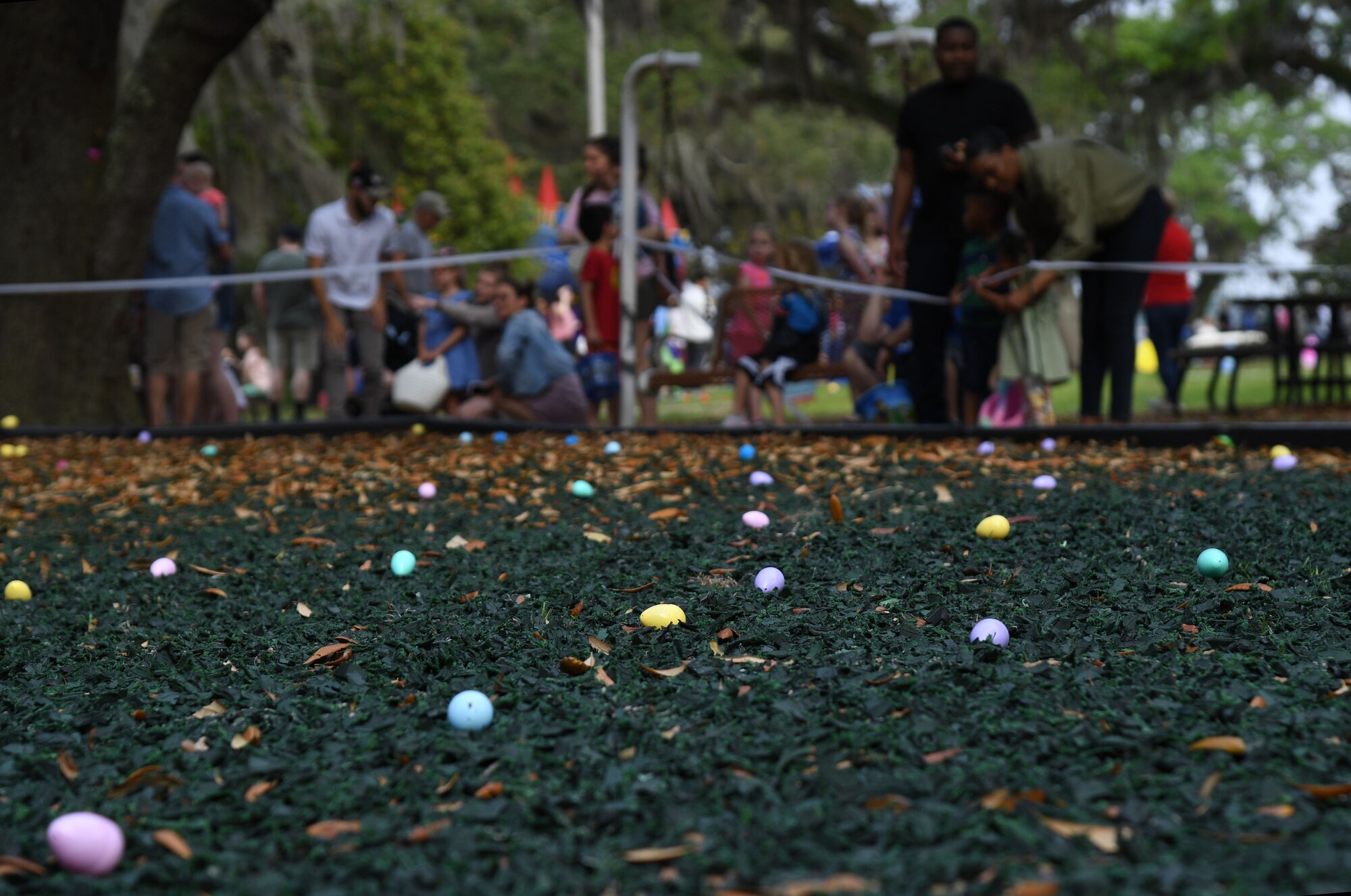 Plastic Easter eggs lay in the grass during Easter in the Park at Keesler Air Force Base, Mississippi, April 1, 2023.