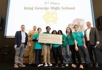 IMAGE: Naval Surface Warfare Center Dahlgren Division’s Technical Director Dale Sisson Jr., SES, and Commanding Officer Captain Philip Mlynarski, along with University of Mary Washington’s Dr. John Burrow (left), pose with the King George High School’s (KGHS) robotics team who placed third in Innovation Challenge @ Dahlgren. KGHS was able to field two teams for the event.