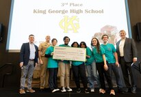 IMAGE: Naval Surface Warfare Center Dahlgren Division’s Technical Director Dale Sisson Jr., SES, and Commanding Officer Captain Philip Mlynarski, along with University of Mary Washington’s Dr. John Burrow (left), pose with the King George High School’s (KGHS) robotics team who placed third in Innovation Challenge @ Dahlgren. KGHS was able to field two teams for the event.