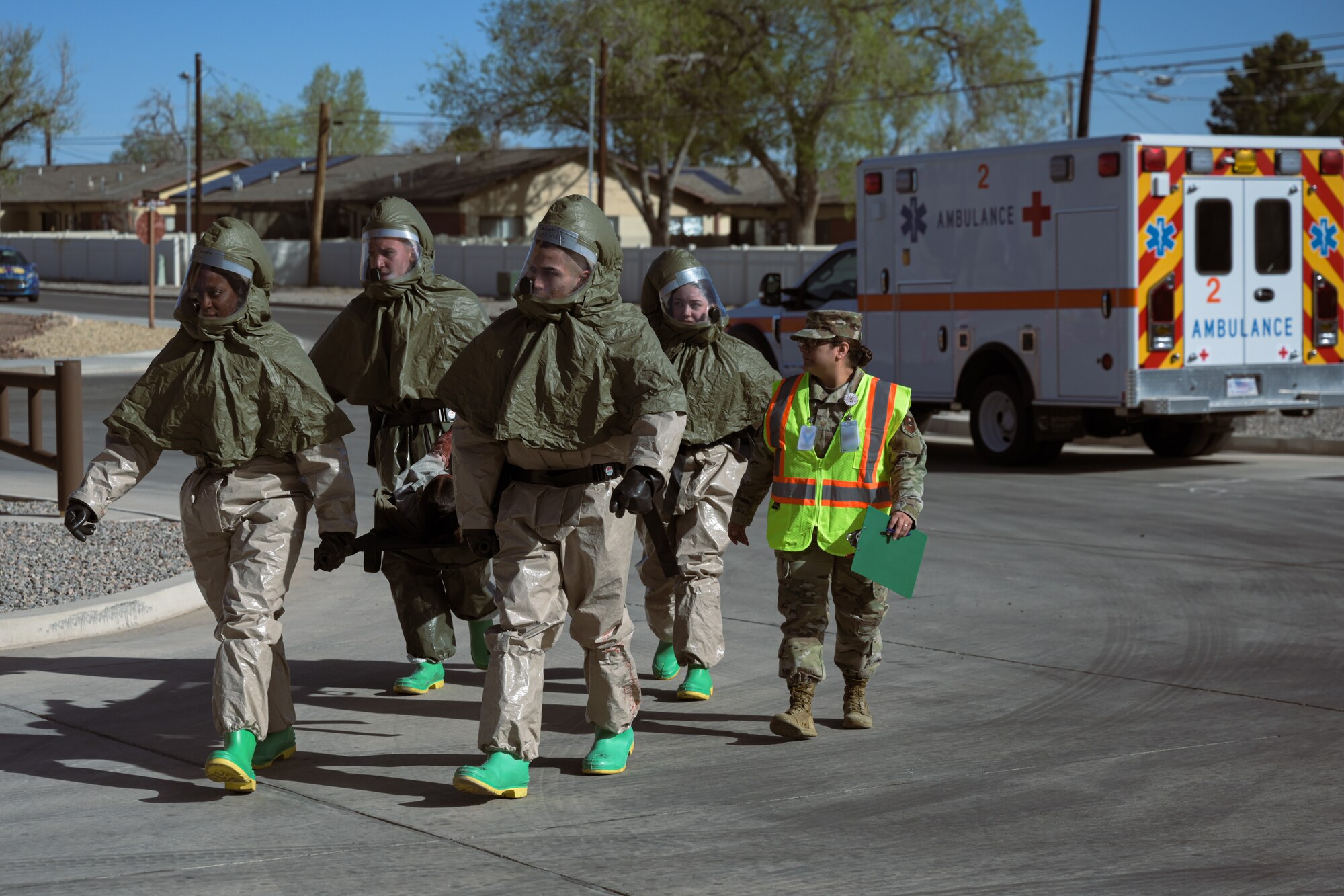 Members from the 49th Medical Group prepare a patient to be transported during a Ready Eagle exercise at Holloman Air Force Base, New Mexico, March 30, 2023. The initial response teams were responsible for on-the-scene care and patient transport. (U.S. Air Force by Senior Airman Antonio Salfran)