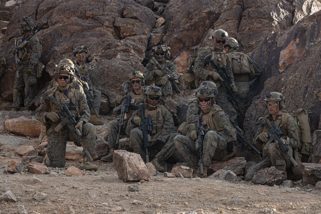 U.S. Marines with 3rd Battalion, 5th Marine Regiment, 1st Marine Division, standby for live-fire during a company level attack exercise at Marine Corps Air Ground Combat Center, Twentynine Palms, California, March 7, 2023. Company level training ensures that Marines are trained in breaching obstacles, working under pressure, and adapting to changing scenarios. (U.S. Marine Corps photo by Lance Cpl. Anna Higman)