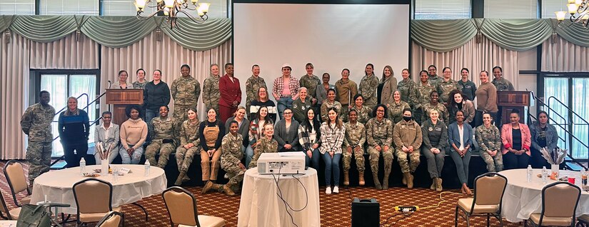 Attendees pose for a group photo with panelists at the Women’s Empowerment forum on Joint Base MDL, N.J., Apr. 3, 2023. Joint Base McGuire-Dix-Lakehurst hosted the Women’s Empowerment forum on April 3rd, as a part of wrapping up Women’s History Month, observed in March. The Women’s Empowerment forum is an inclusive and collaborative space for military and civilian women and supporters to connect and engage with each other. (Courtesy Photo)