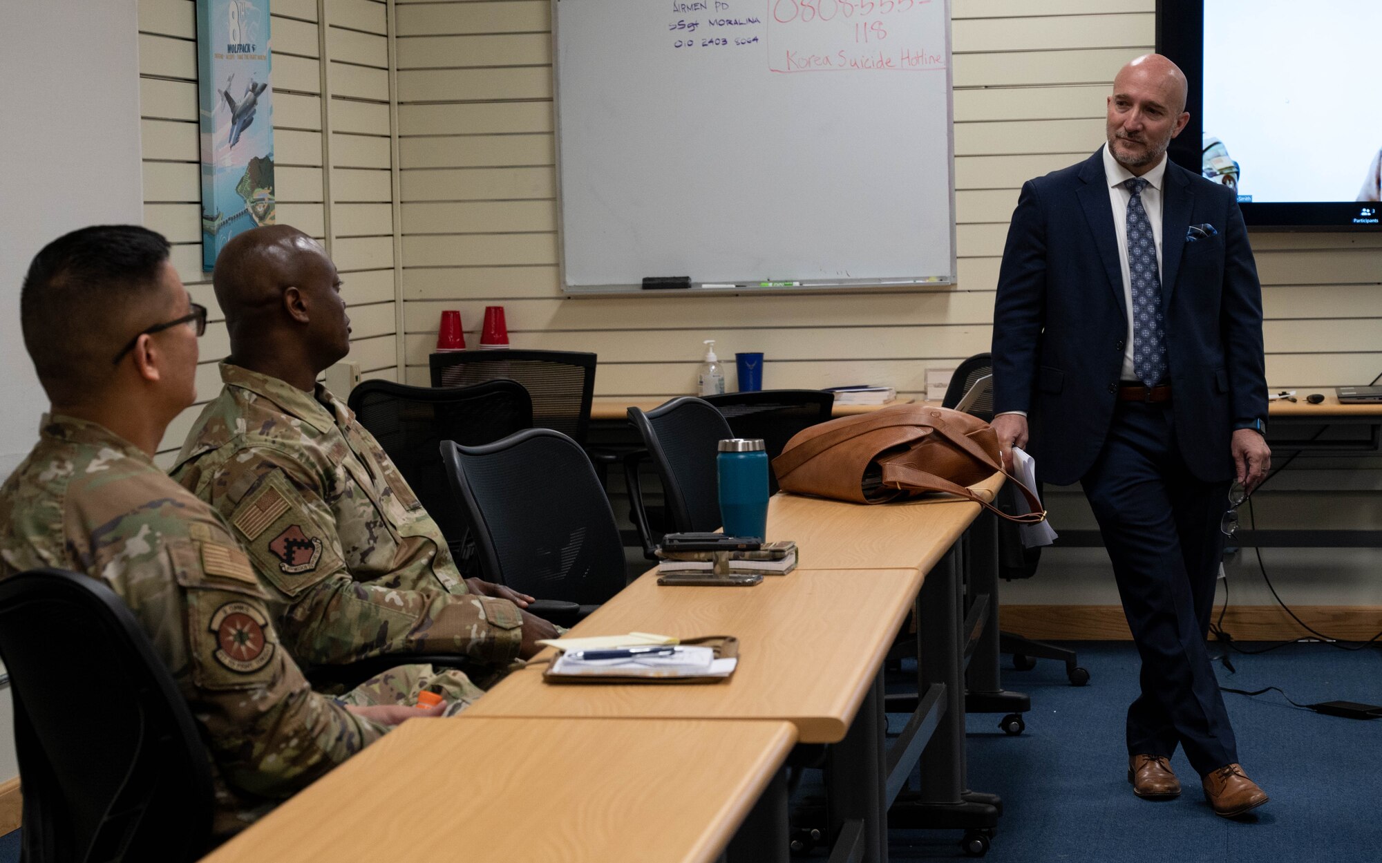 Mr. Anthony Cruz Unoz (right), Pacific Air Forces Chief Diversity & Inclusion Officer, speaks with leaders from around the Wolf Pack during Leading Inclusively Virtual Experience training at Kunsan Air Base, Republic of Korea, April 5, 2023.