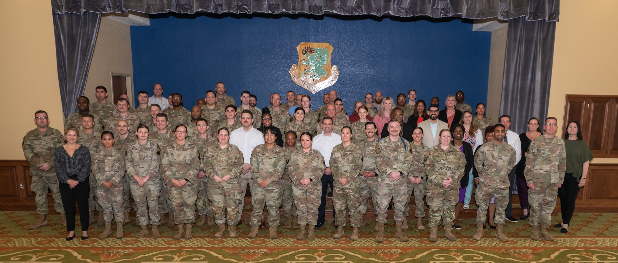 Keesler personnel pose for a group photo during LEAD-a-thon at the Bay Breeze Event Center on Keesler Air Force Base, Mississippi, April 4, 2023.