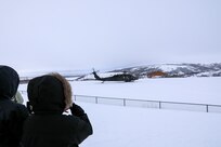 Community members watch as an Alaska Army National Guard UH-60 Black Hawk helicopter departs St. Mary’s March 31, 2023. The Association of Village Council Presidents recently partnered with the Alaska National Guard to provide recruiting information and resources through their Tribal Job Centers. The initiative kicked off in St. Mary’s with presentations from AVCP and AKNG at the Andreafski High School, where representatives interacted with students, parents, teachers, and community members. AVCP provides community development, education, social services, culturally relevant programs, and advocacy for the people and 56 tribes of Western Alaska.