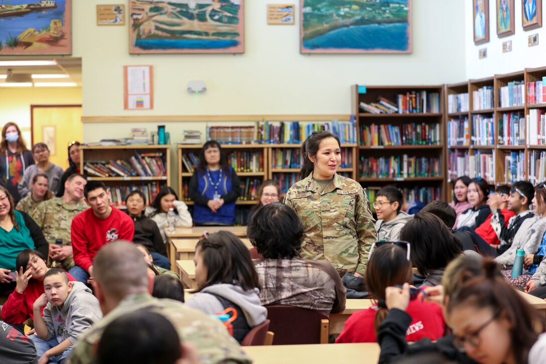 Alaska Air National Guard Staff Sgt. Sharon Queenie, a surveillance technician with the 176th Air Defense Squadron, gives a presentation to students from her hometown of St. Mary’s, Alaska, during a recruiting initiative in partnership with the Association of Village Council Presidents at the Andreafski High School, March 31, 2023. The Association of Village Council Presidents recently partnered with the Alaska National Guard to provide recruiting information and resources through their Tribal Job Centers. The initiative kicked off in St. Mary’s with presentations from AVCP and AKNG, where representatives interacted with students, parents, teachers, and community members. AVCP provides community development, education, social services, culturally relevant programs, and advocacy for the people and 56 tribes of Western Alaska.