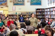 Alaska Air National Guard Staff Sgt. Sharon Queenie, a surveillance technician with the 176th Air Defense Squadron, gives a presentation to students from her hometown of St. Mary’s, Alaska, during a recruiting initiative in partnership with the Association of Village Council Presidents at the Andreafski High School, March 31, 2023. The Association of Village Council Presidents recently partnered with the Alaska National Guard to provide recruiting information and resources through their Tribal Job Centers. The initiative kicked off in St. Mary’s with presentations from AVCP and AKNG, where representatives interacted with students, parents, teachers, and community members. AVCP provides community development, education, social services, culturally relevant programs, and advocacy for the people and 56 tribes of Western Alaska.