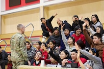 Master Sgt. Michael Thomas, incoming Recruiting and Retention superintendent for the Alaska Air National Guard, distributes prizes and recruiting swag to students at the Andreafski High School in St. Mary’s, Alaska, March 31, 2023. The Association of Village Council Presidents recently partnered with the Alaska National Guard to provide recruiting information and resources through their Tribal Job Centers. The initiative kicked off in St. Mary’s with presentations from AVCP and AKNG, where representatives interacted with students, parents, teachers, and community members. AVCP provides community development, education, social services, culturally relevant programs, and advocacy for the people and 56 tribes of Western Alaska.