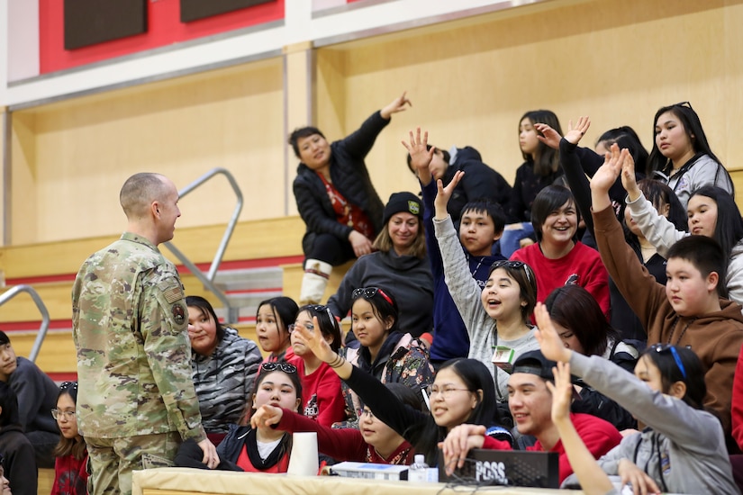 Master Sgt. Michael Thomas, incoming Recruiting and Retention superintendent for the Alaska Air National Guard, distributes prizes and recruiting swag to students at the Andreafski High School in St. Mary’s, Alaska, March 31, 2023. The Association of Village Council Presidents recently partnered with the Alaska National Guard to provide recruiting information and resources through their Tribal Job Centers. The initiative kicked off in St. Mary’s with presentations from AVCP and AKNG, where representatives interacted with students, parents, teachers, and community members. AVCP provides community development, education, social services, culturally relevant programs, and advocacy for the people and 56 tribes of Western Alaska.